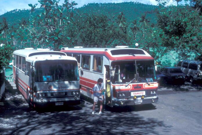 12588 (42) Manly Express Mitsubishi (Fuso) for Coach CHD-946 and Department of Tourism for (Rajah Tours) Isuzu Coach NVB-347 outside the Falls Lodge, Pagsanjan, Philippines.
